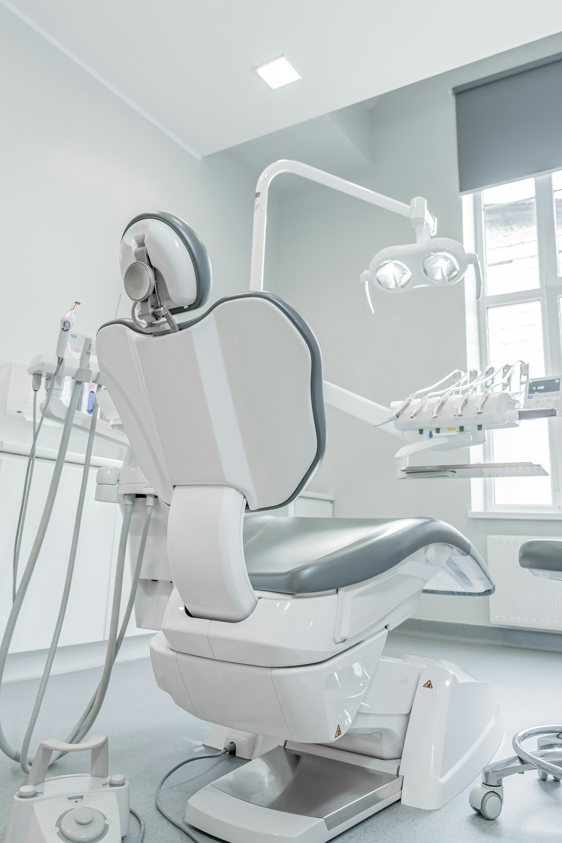 Illustrative sunlit dental treatment room, not the actual clinic